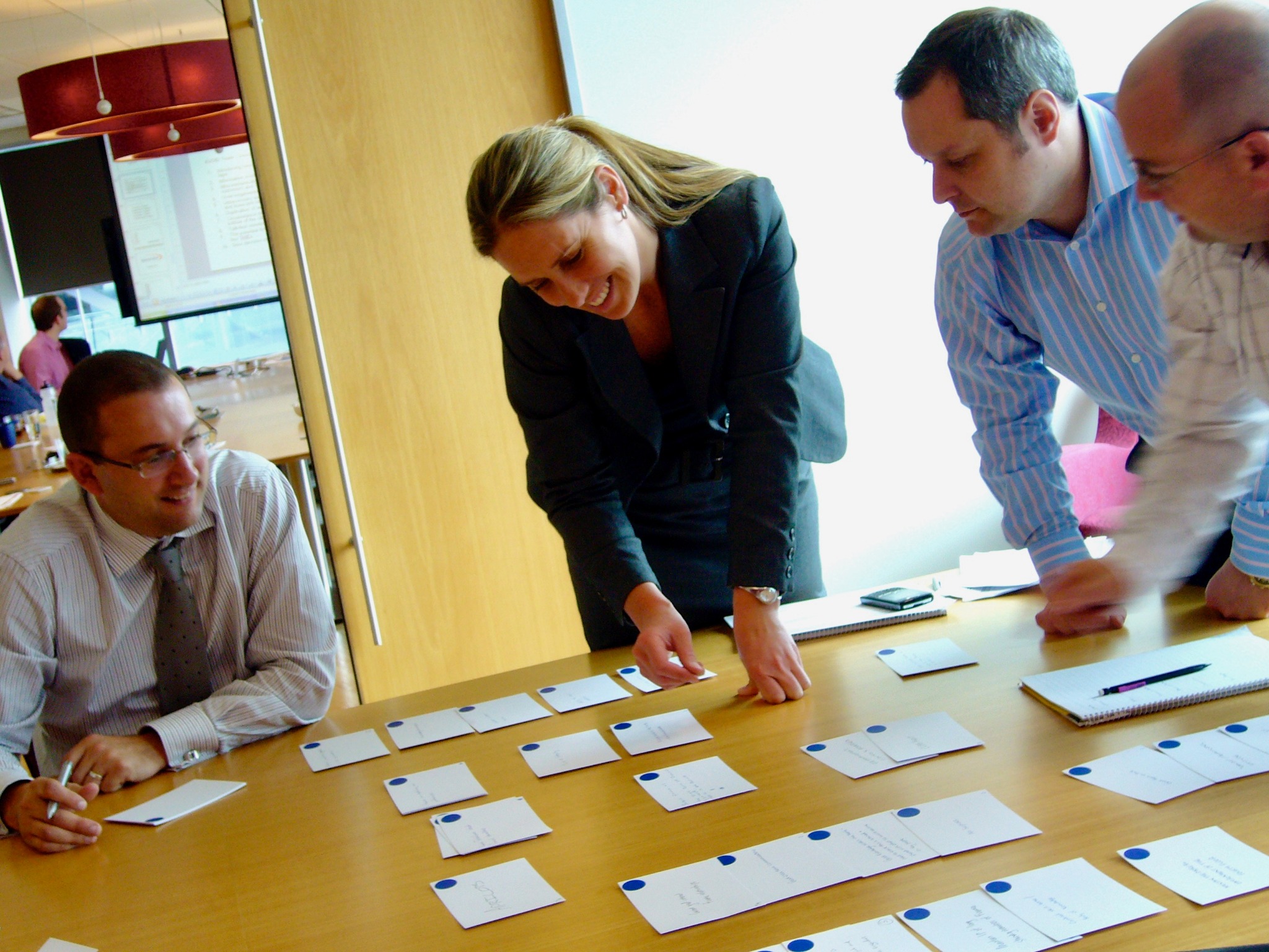 Participants arranging and discussing cards during an Actions That Matter working session.